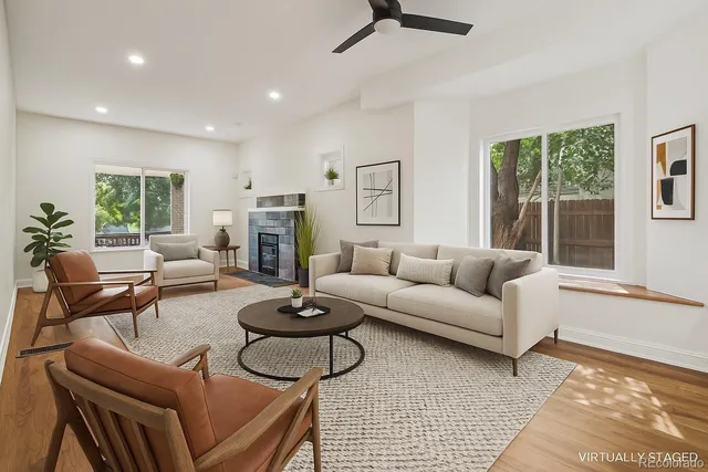 a living room with furniture and a fireplace
