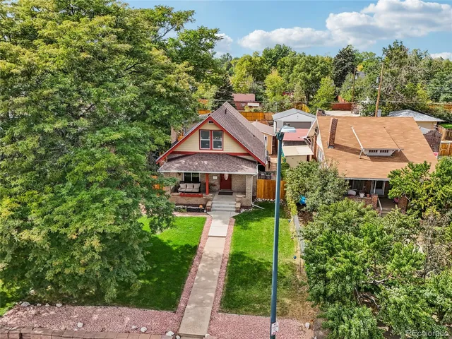 aerial view of a house with a yard