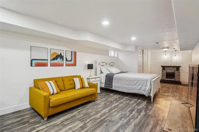 a spacious bedroom with a bed and a couch