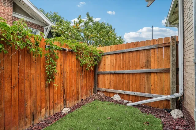 a view of outdoor space with a wooden fence