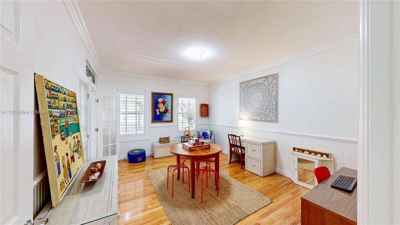 24545 Southwest 192nd Avenue Homestead, FL 33031 - Photo 11 of 91 a living room with patio furniture and a flat screen tv