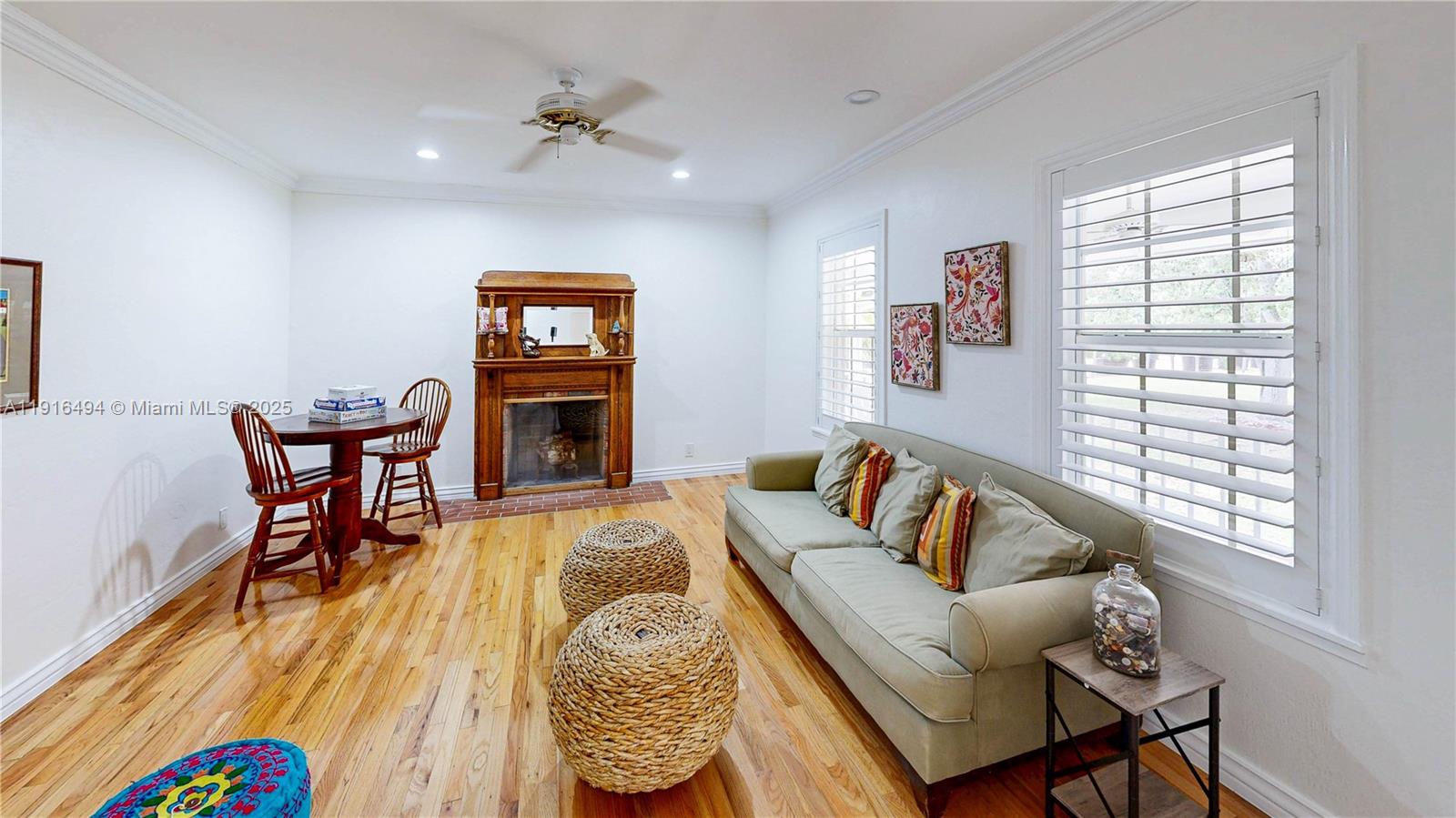 24545 Southwest 192nd Avenue Homestead, FL 33031 - Photo 12 of 91 a living room with furniture and a fireplace