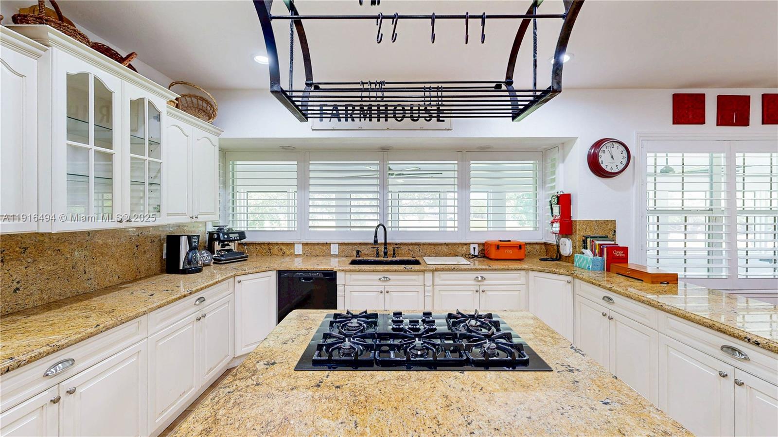 24545 Southwest 192nd Avenue Homestead, FL 33031 - Photo 18 of 91 a kitchen with stainless steel appliances a stove a sink and a window