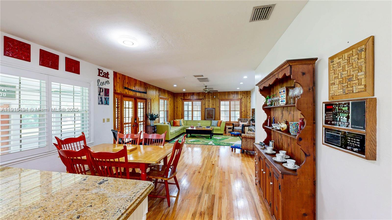 24545 Southwest 192nd Avenue Homestead, FL 33031 - Photo 22 of 91 a living room with furniture and a large window