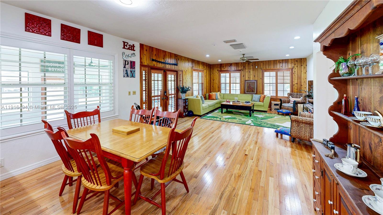 24545 Southwest 192nd Avenue Homestead, FL 33031 - Photo 23 of 91 a view of a dining room with furniture a chandelier and wooden floor