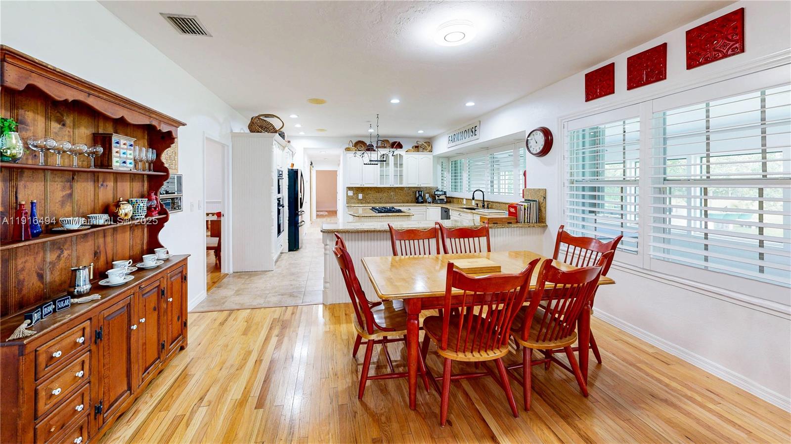 24545 Southwest 192nd Avenue Homestead, FL 33031 - Photo 25 of 91 a dining room with furniture and wooden floor
