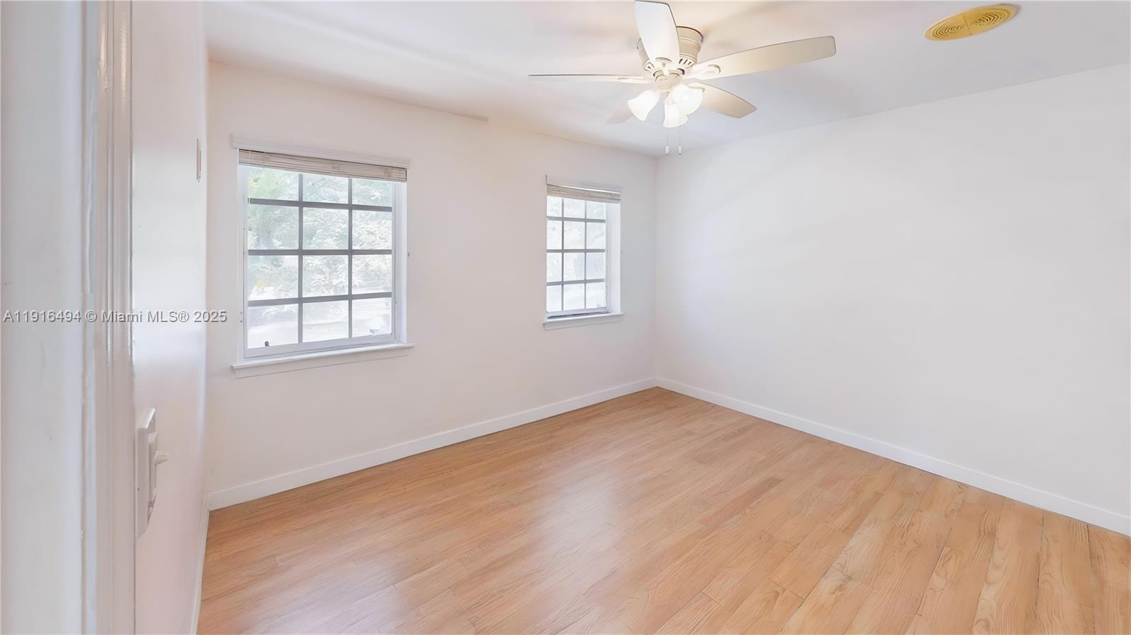 24545 Southwest 192nd Avenue Homestead, FL 33031 - Photo 33 of 91 an empty room with windows and fan