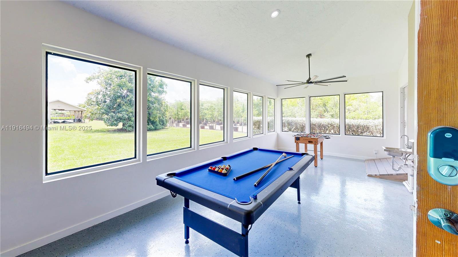 24545 Southwest 192nd Avenue Homestead, FL 33031 - Photo 38 of 91 a living room with furniture and a large window