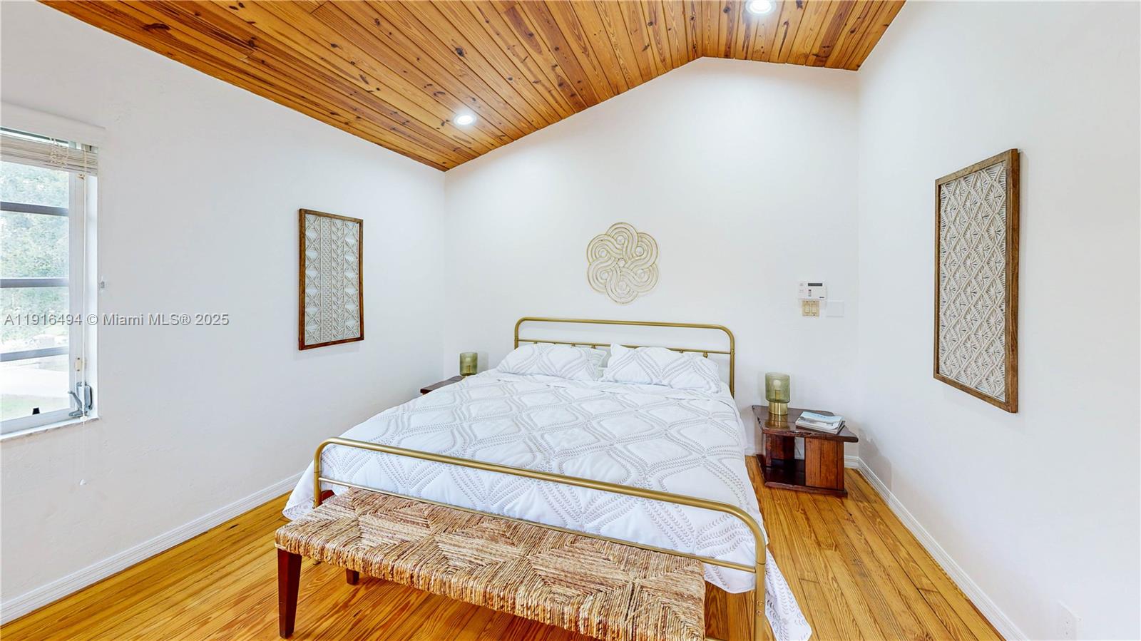 24545 Southwest 192nd Avenue Homestead, FL 33031 - Photo 48 of 91 a bedroom with a bed and a window