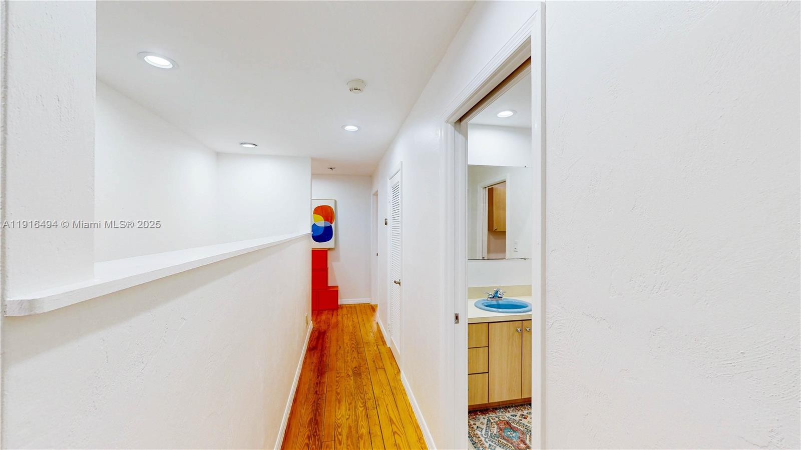 24545 Southwest 192nd Avenue Homestead, FL 33031 - Photo 52 of 91 a view of a hallway with wooden floor and entryway