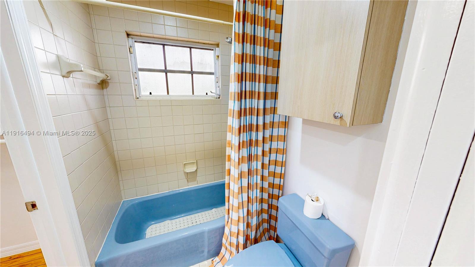 24545 Southwest 192nd Avenue Homestead, FL 33031 - Photo 54 of 91 a bathroom with a shower and a toilet