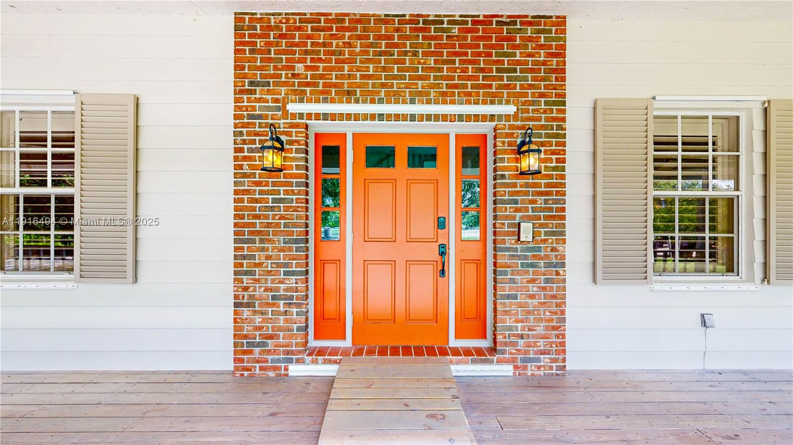 24545 Southwest 192nd Avenue Homestead, FL 33031 - Photo 6 of 91 a front view of a house with a large window