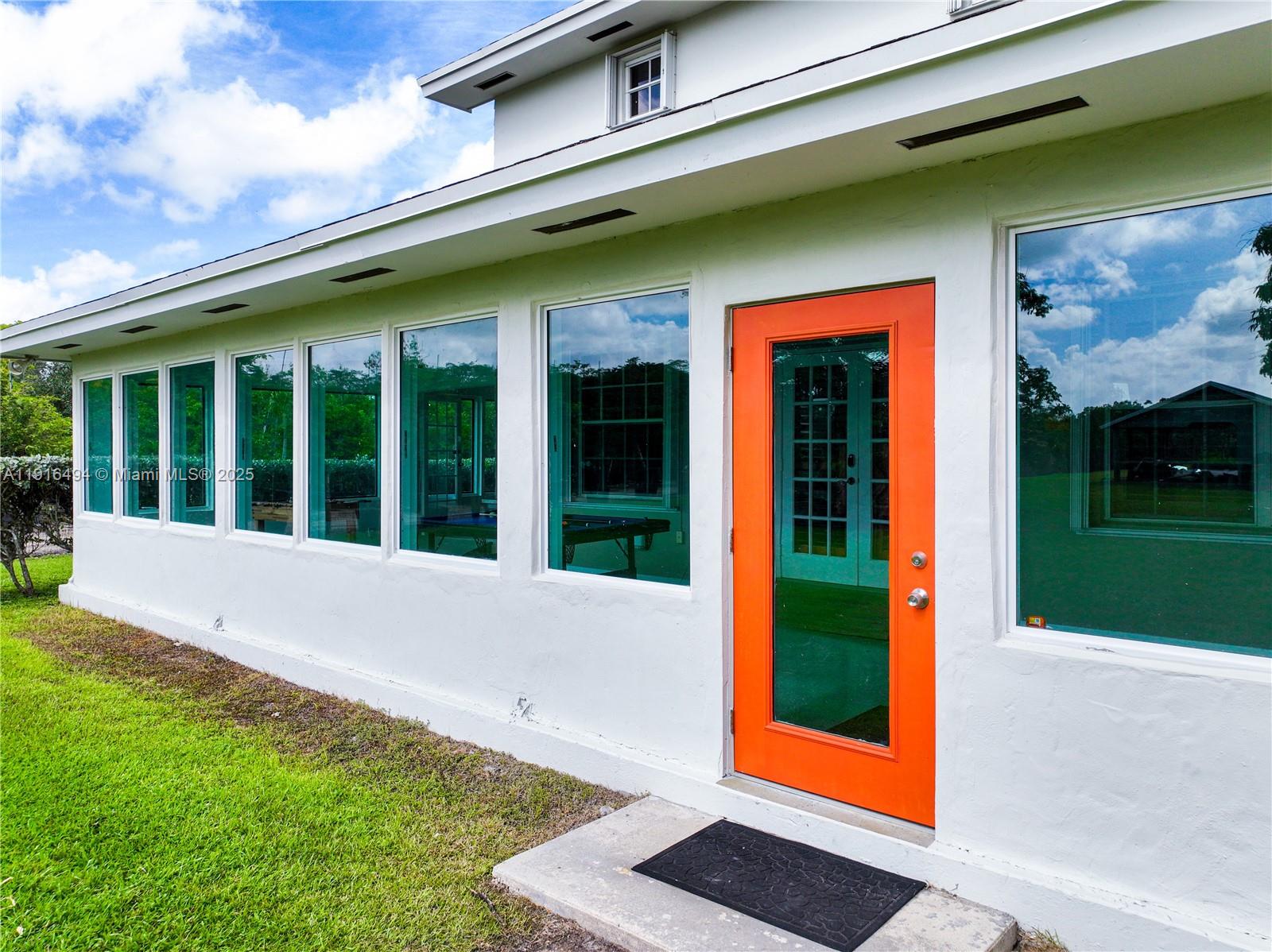 24545 Southwest 192nd Avenue Homestead, FL 33031 - Photo 66 of 91 a view of yellow house with a large window