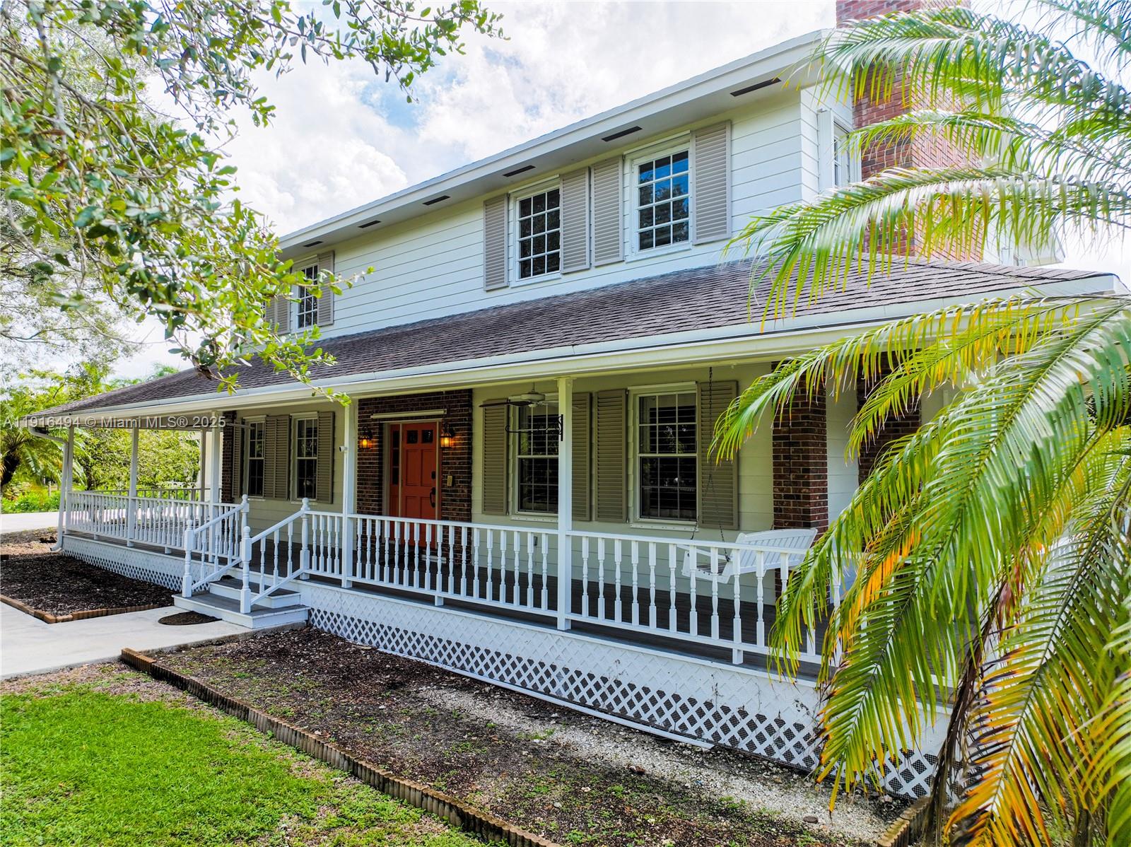24545 Southwest 192nd Avenue Homestead, FL 33031 - Photo 72 of 91 front view of a house with a porch