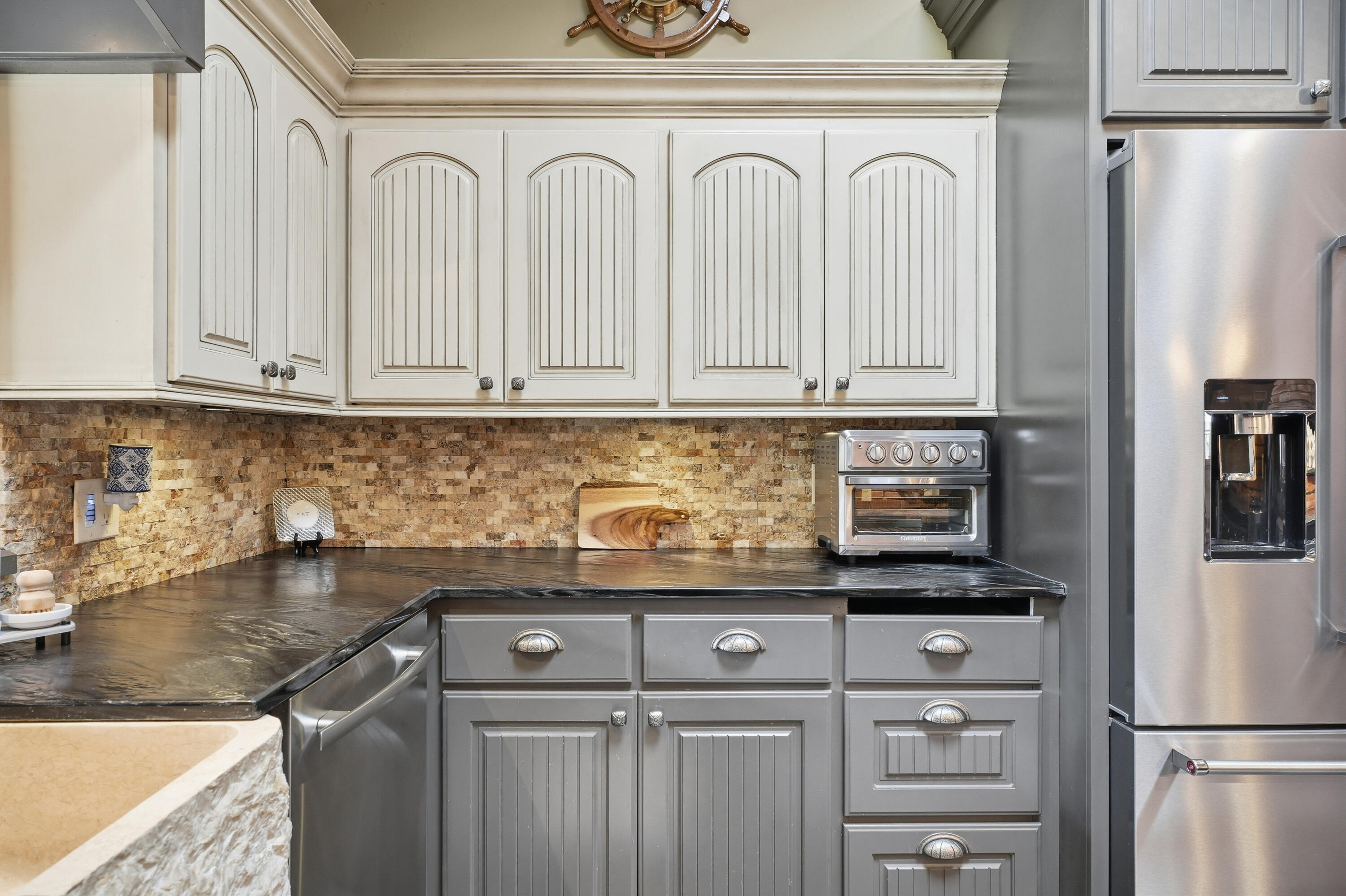 4602 13th Street Lubbock, TX 79416 - Photo 16 of 54 a kitchen with appliances cabinets and a counter top space