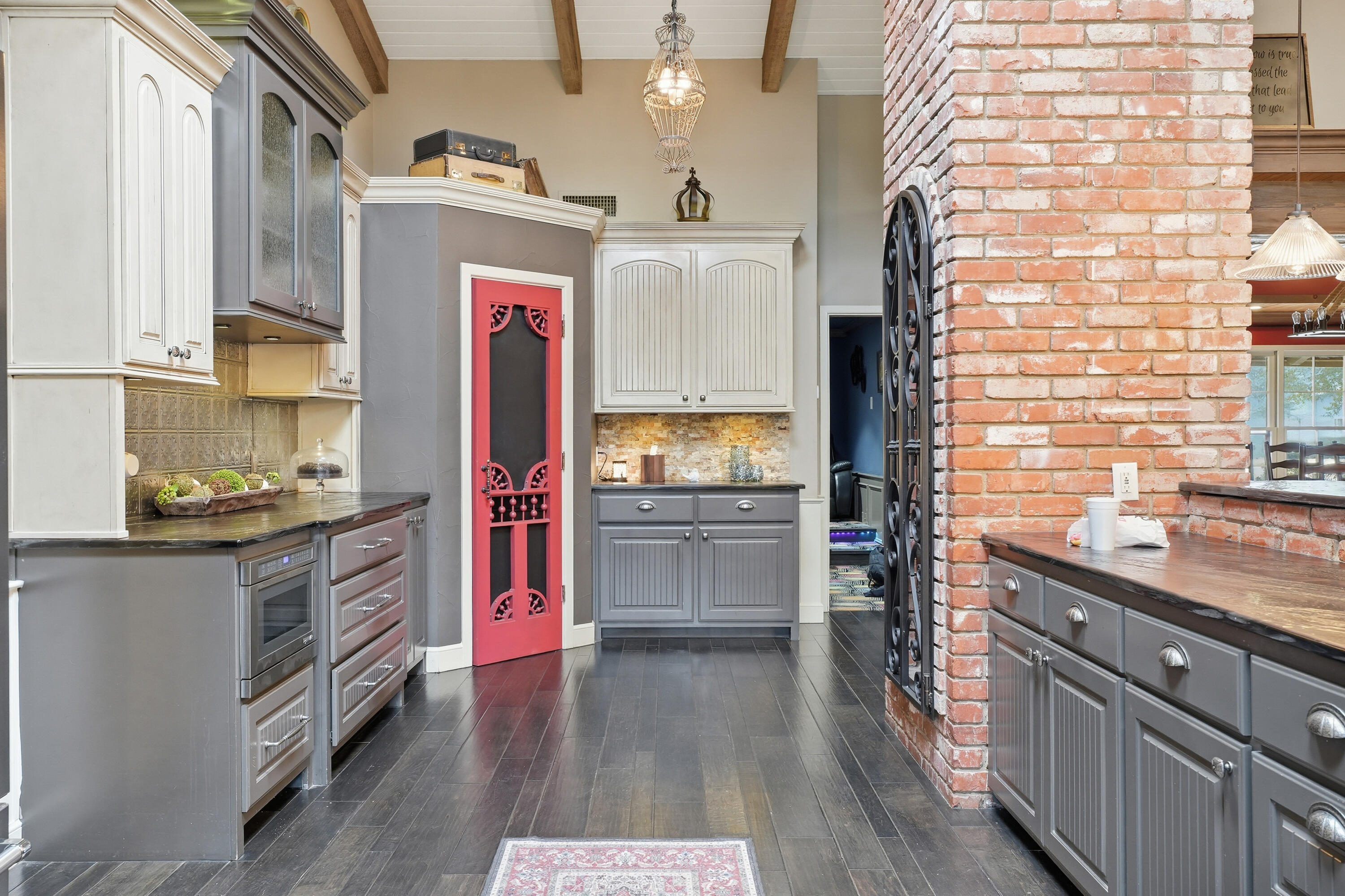 4602 13th Street Lubbock, TX 79416 - Photo 17 of 54 a kitchen with stainless steel appliances granite countertop a stove and cabinets