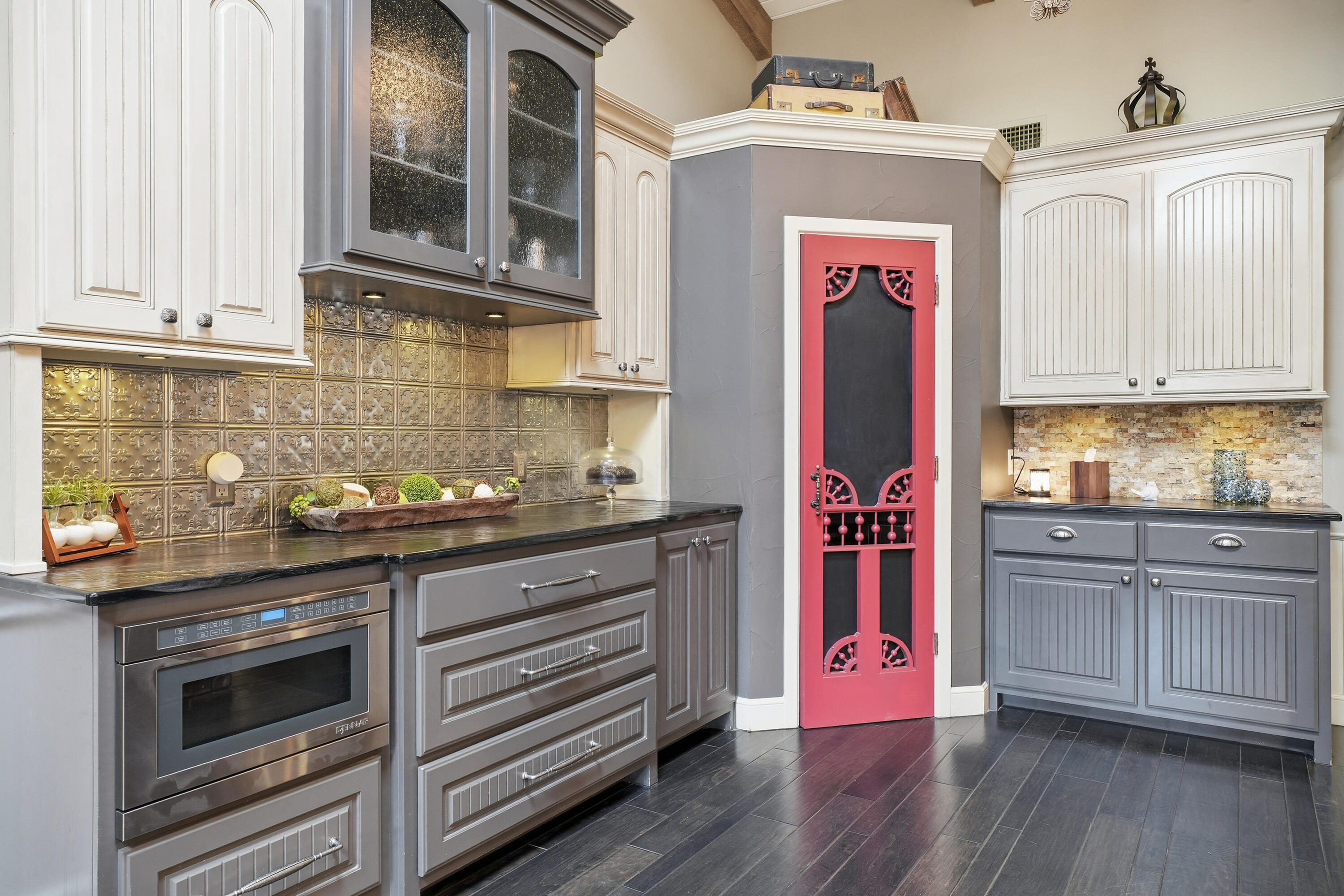 4602 13th Street Lubbock, TX 79416 - Photo 18 of 54 a kitchen with stainless steel appliances granite countertop a stove and cabinets
