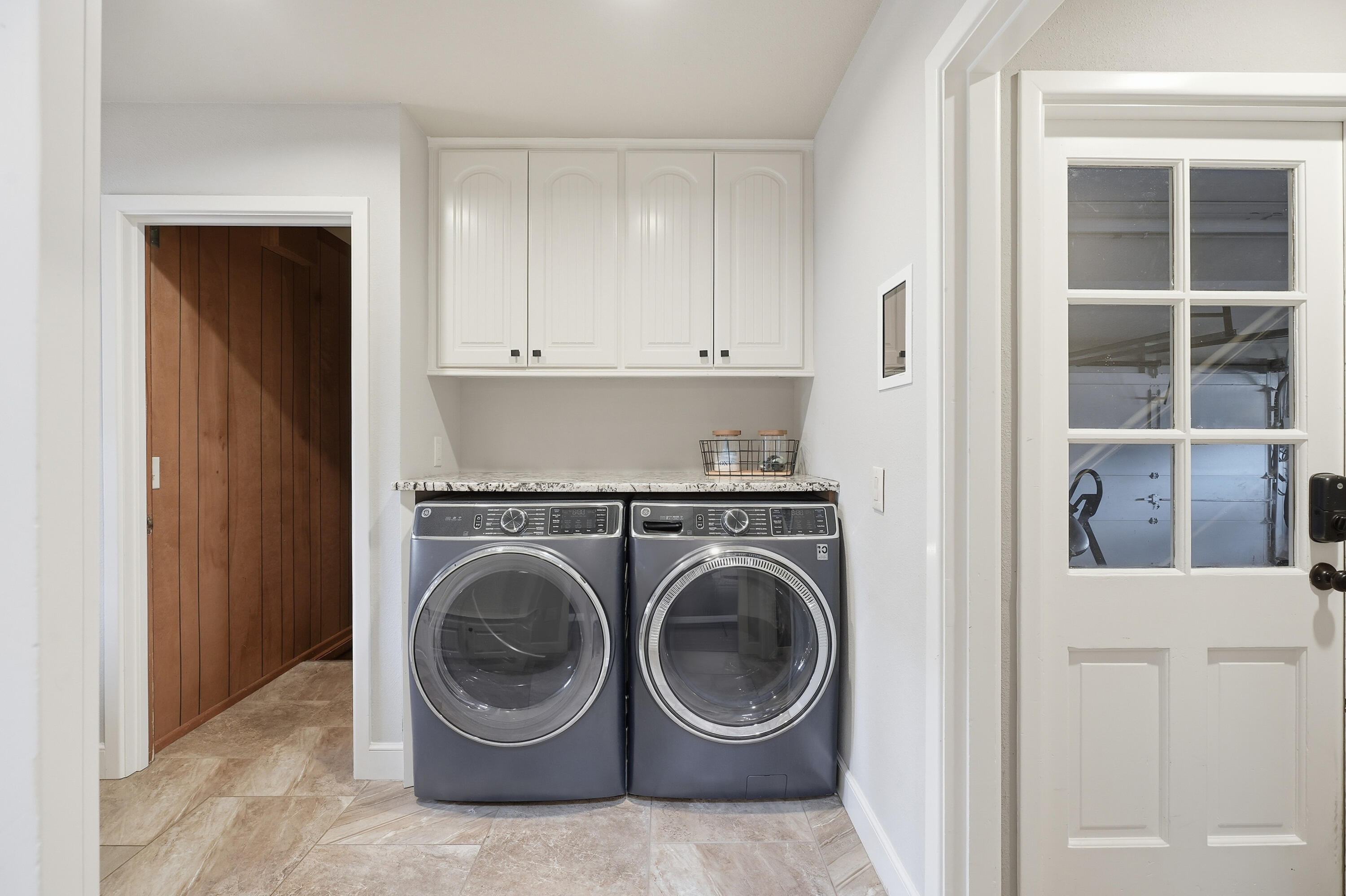 4602 13th Street Lubbock, TX 79416 - Photo 20 of 54 a view of a hallway with washer and dryer