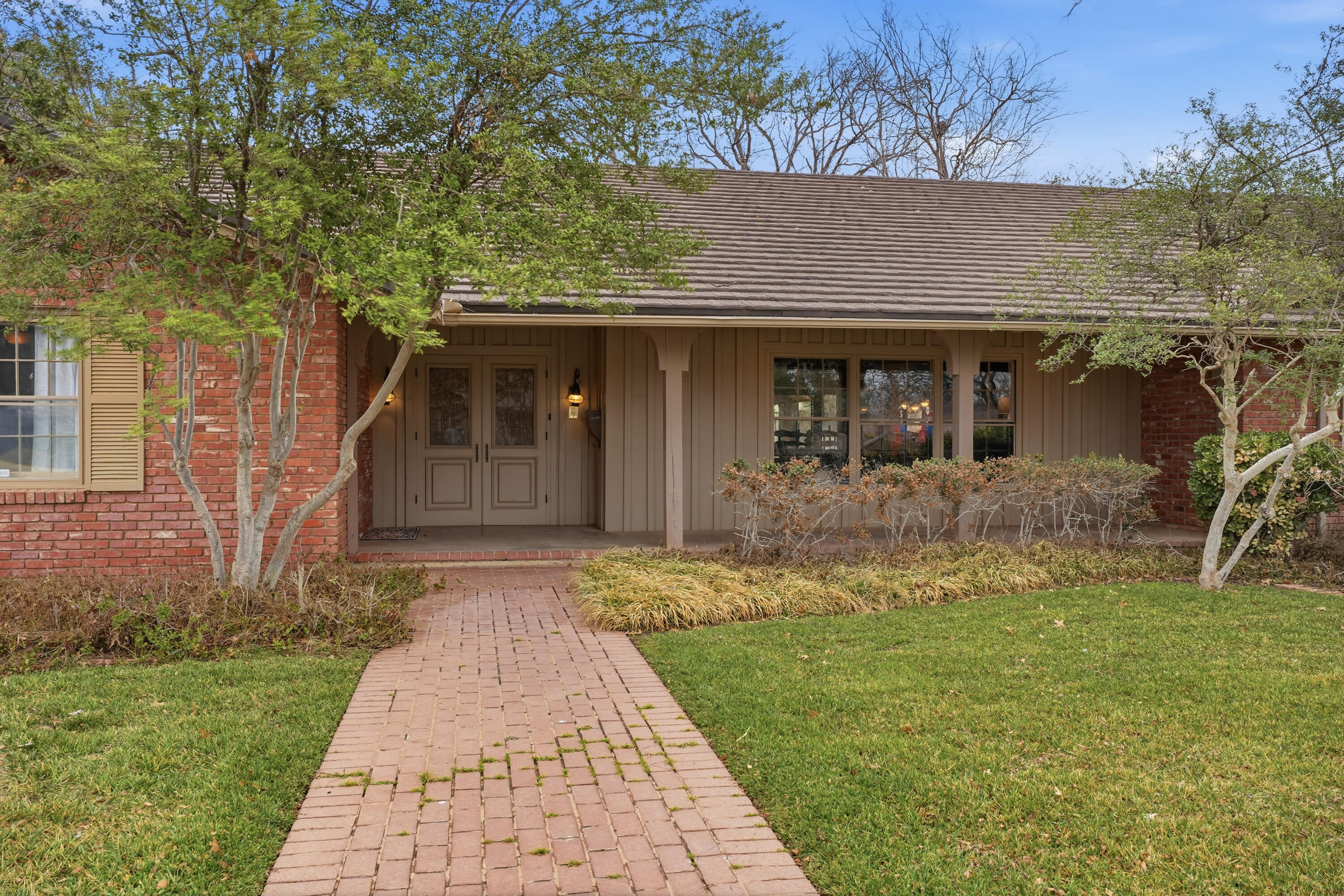4602 13th Street Lubbock, TX 79416 - Photo 2 of 54 front view of a house with a yard