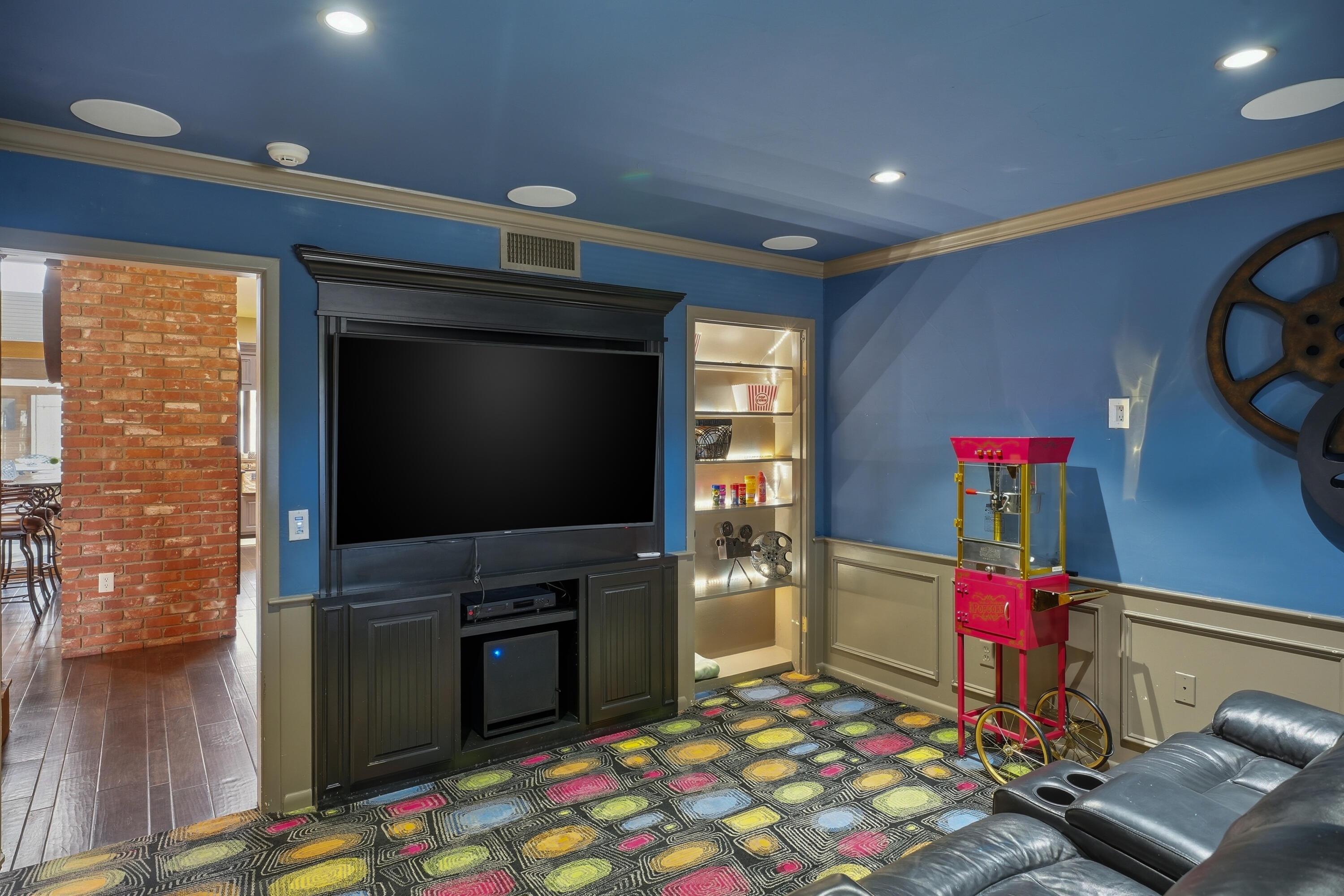 4602 13th Street Lubbock, TX 79416 - Photo 27 of 54 a living room with fireplace furniture and a flat screen tv
