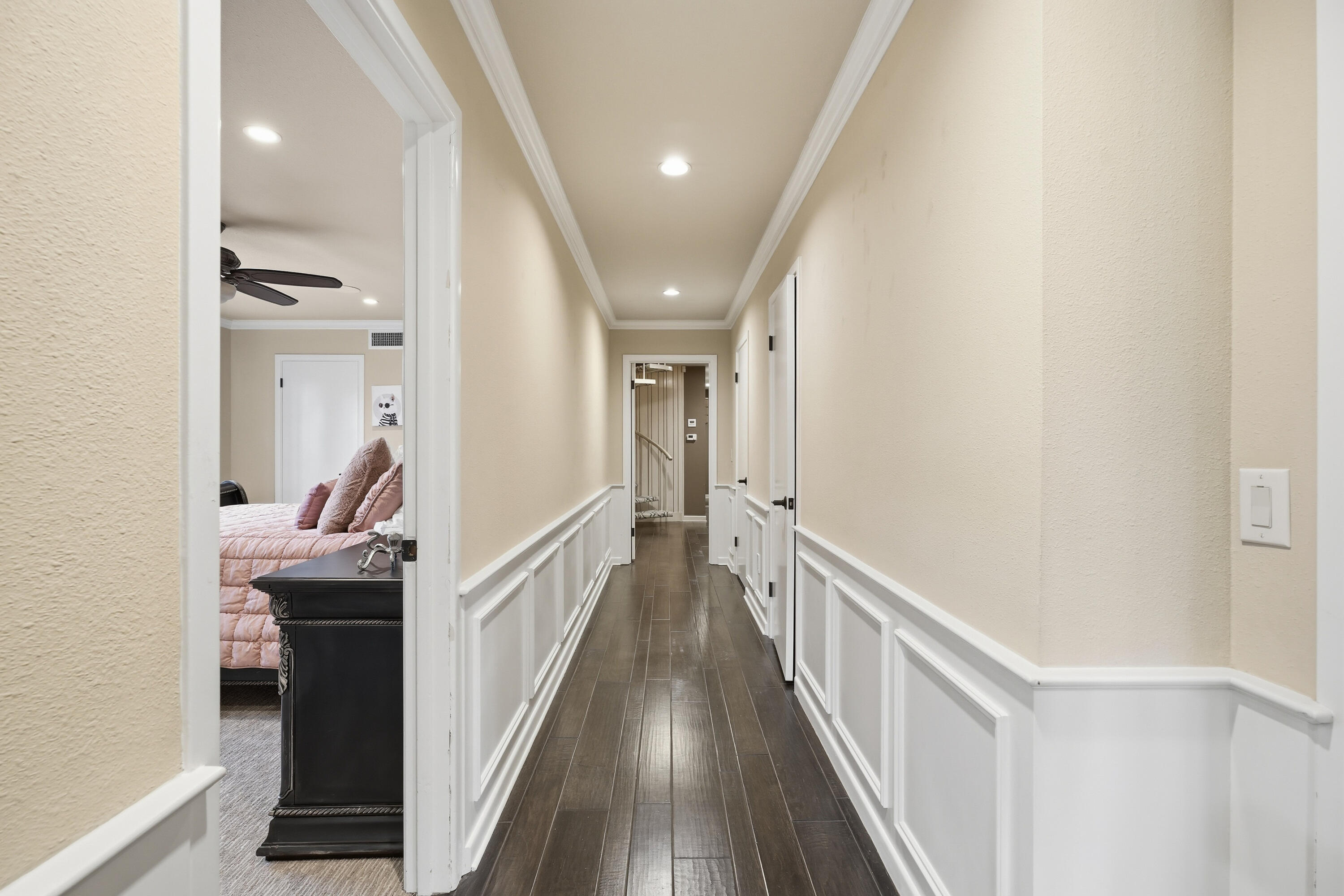 4602 13th Street Lubbock, TX 79416 - Photo 34 of 54 a hallway with wooden floor and staircase