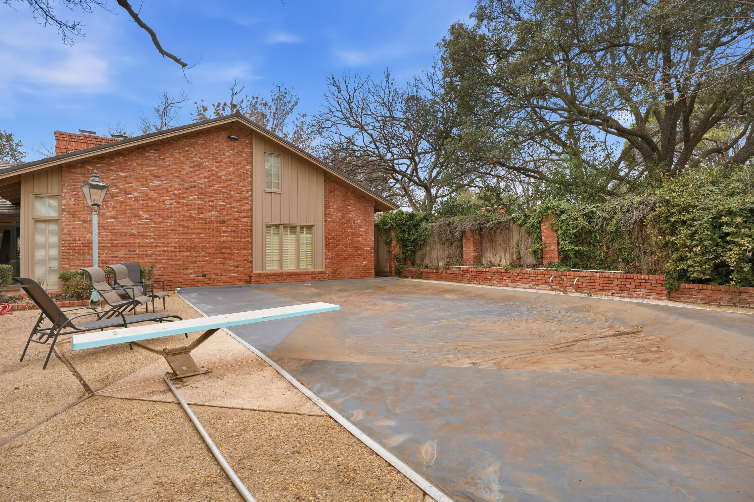 4602 13th Street Lubbock, TX 79416 - Photo 53 of 54 a view of a house with backyard and sitting area