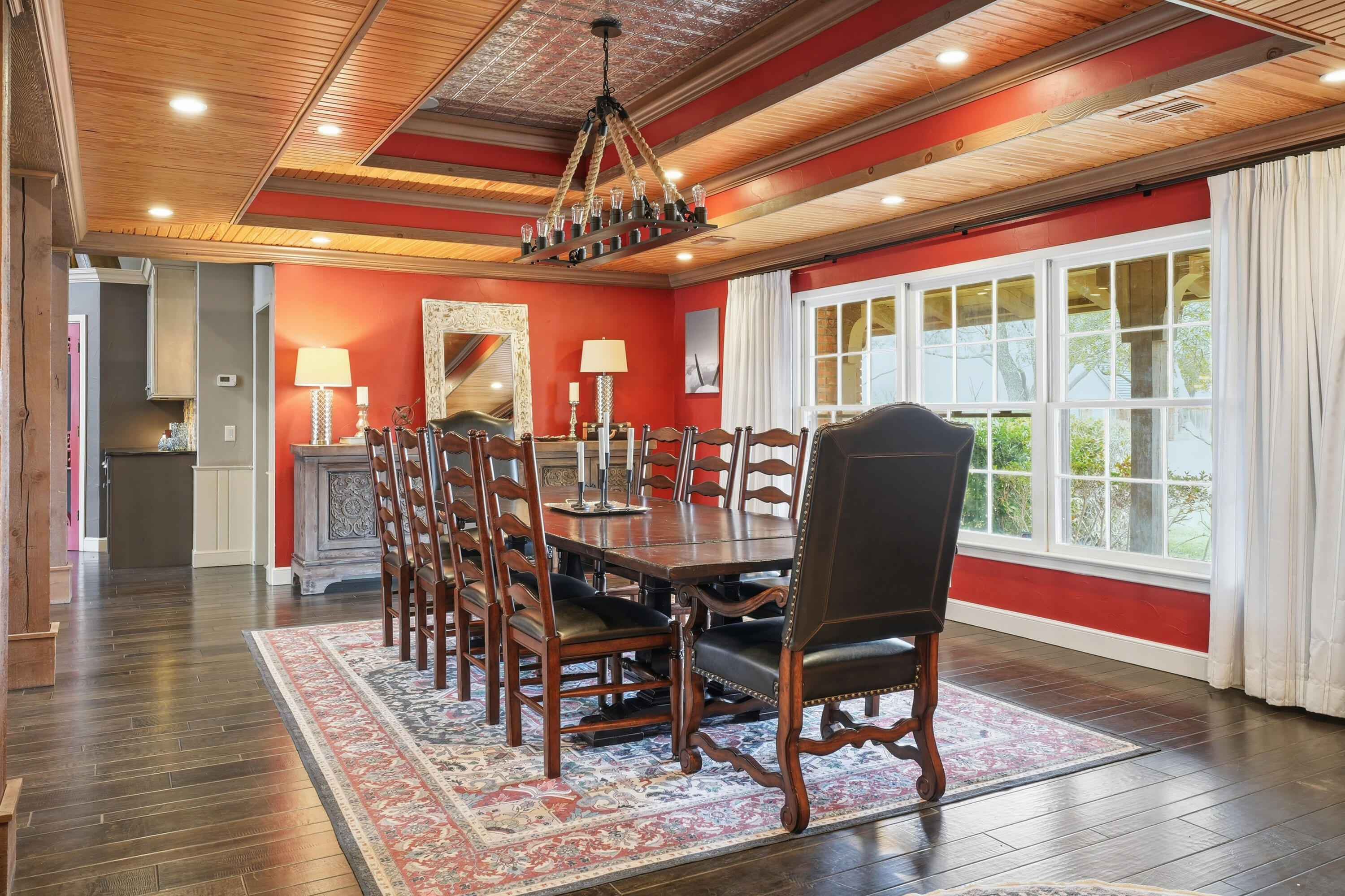 4602 13th Street Lubbock, TX 79416 - Photo 8 of 54 a view of a dining room with furniture wooden floor and chandelier