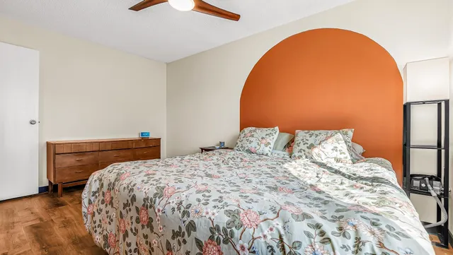 a bedroom with a bed and a dresser