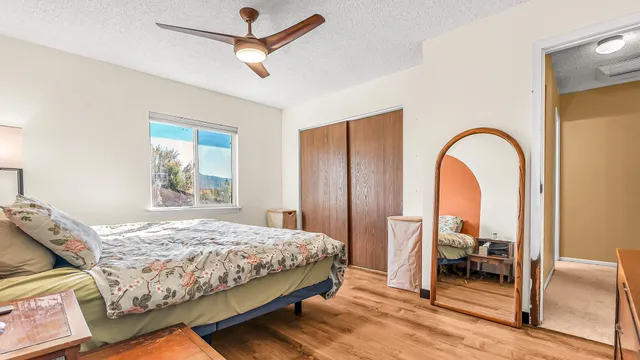 a bedroom with a bed and a window