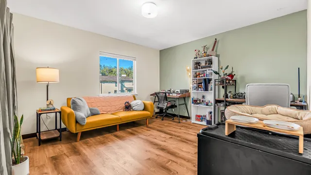 a living room with furniture and a window