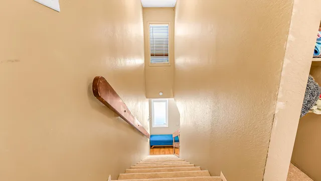 a view of a hallway with windows