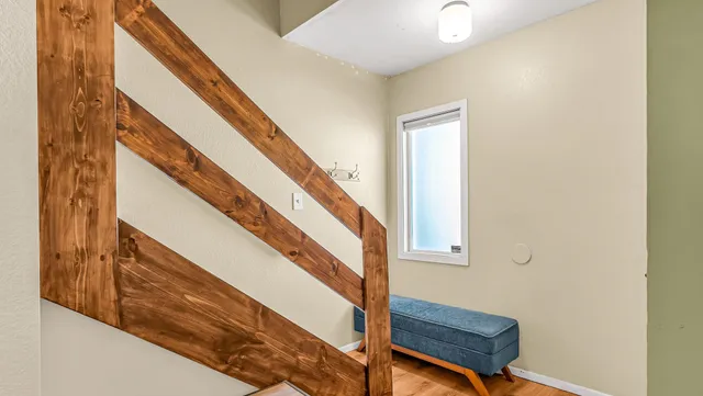 a view of entryway with wooden floor and stairs
