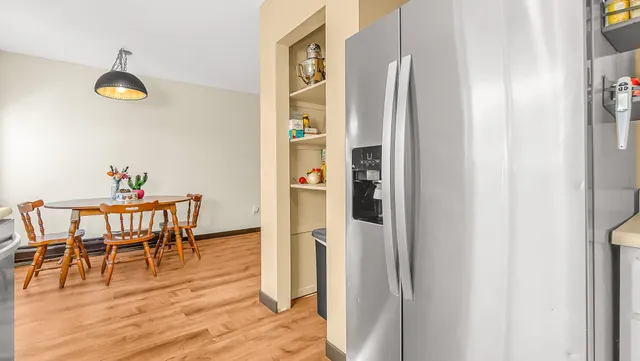 a view of dining room and wooden floor