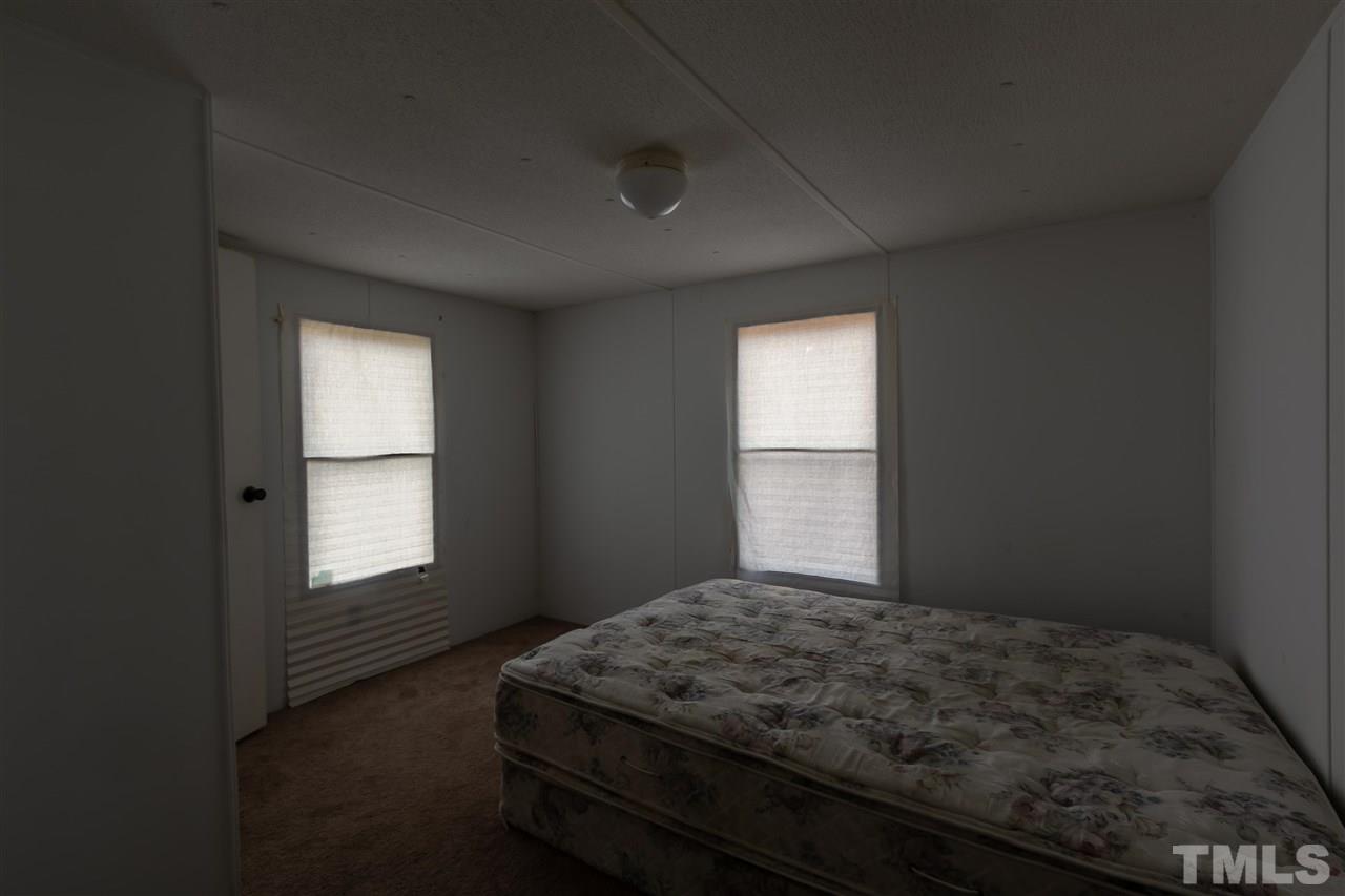 2014 Messer Road Raleigh, NC 27603 - Photo 12 of 27 a bedroom with a bed and a window