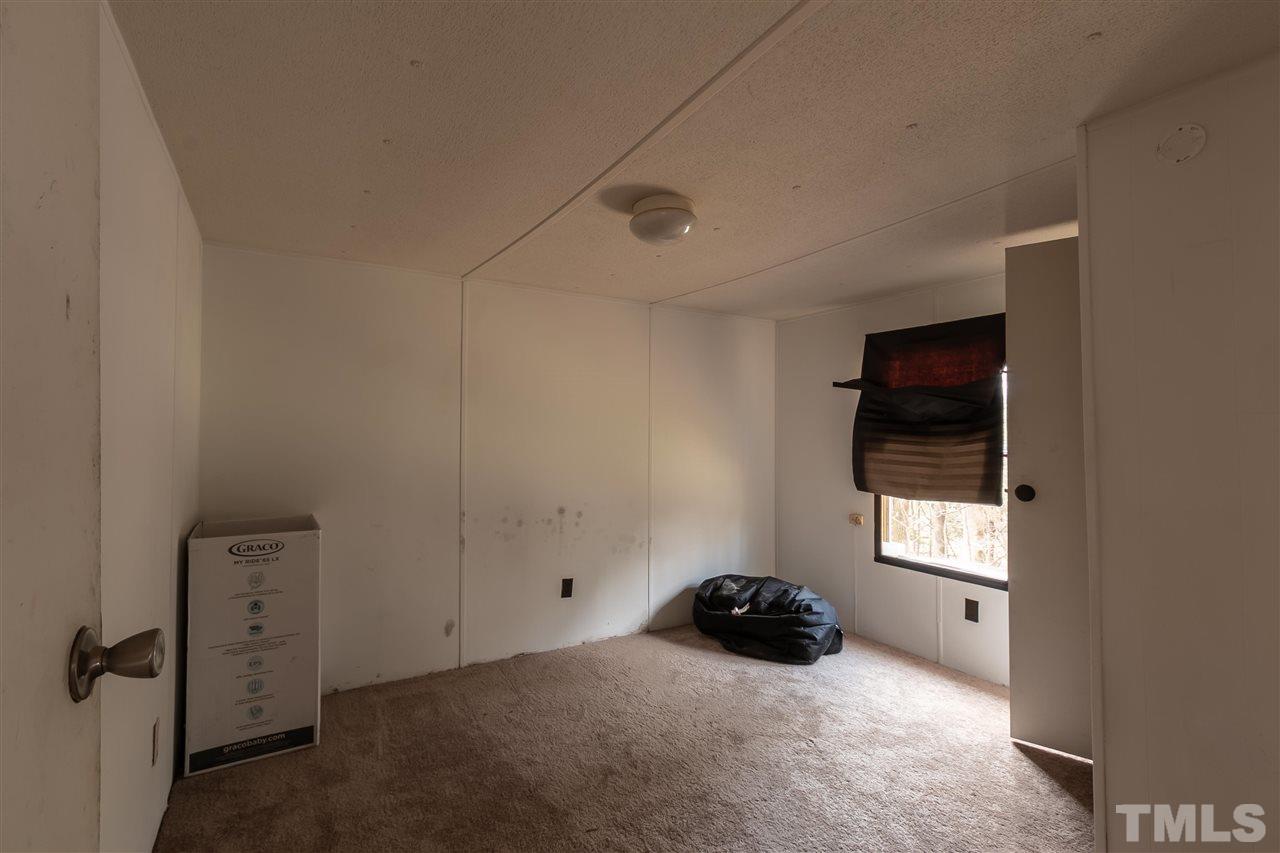 2014 Messer Road Raleigh, NC 27603 - Photo 14 of 27 a room with a bed and a window