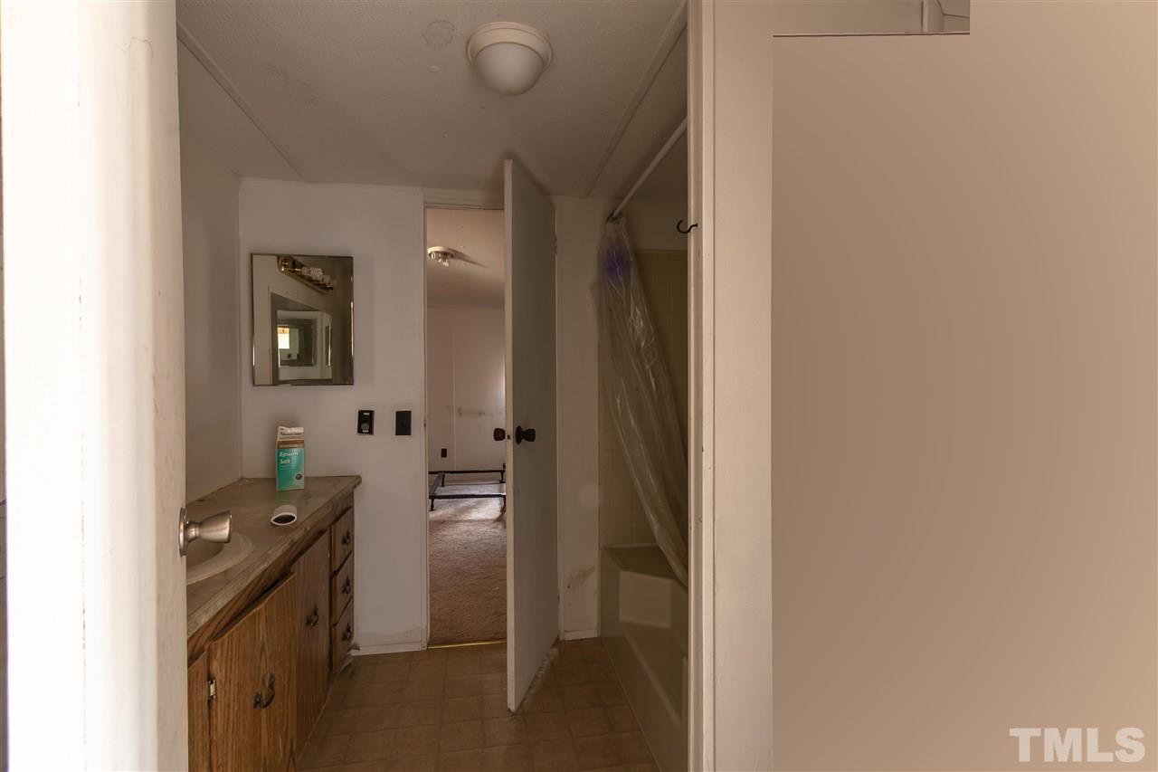 2014 Messer Road Raleigh, NC 27603 - Photo 19 of 27 a kitchen with a refrigerator and a stove