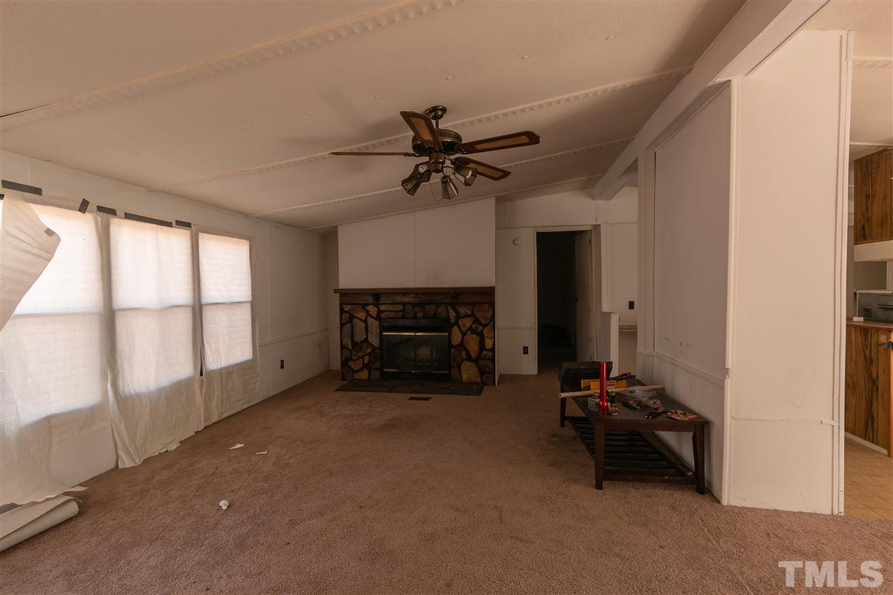 2014 Messer Road Raleigh, NC 27603 - Photo 21 of 27 a room with furniture and a ceiling fan