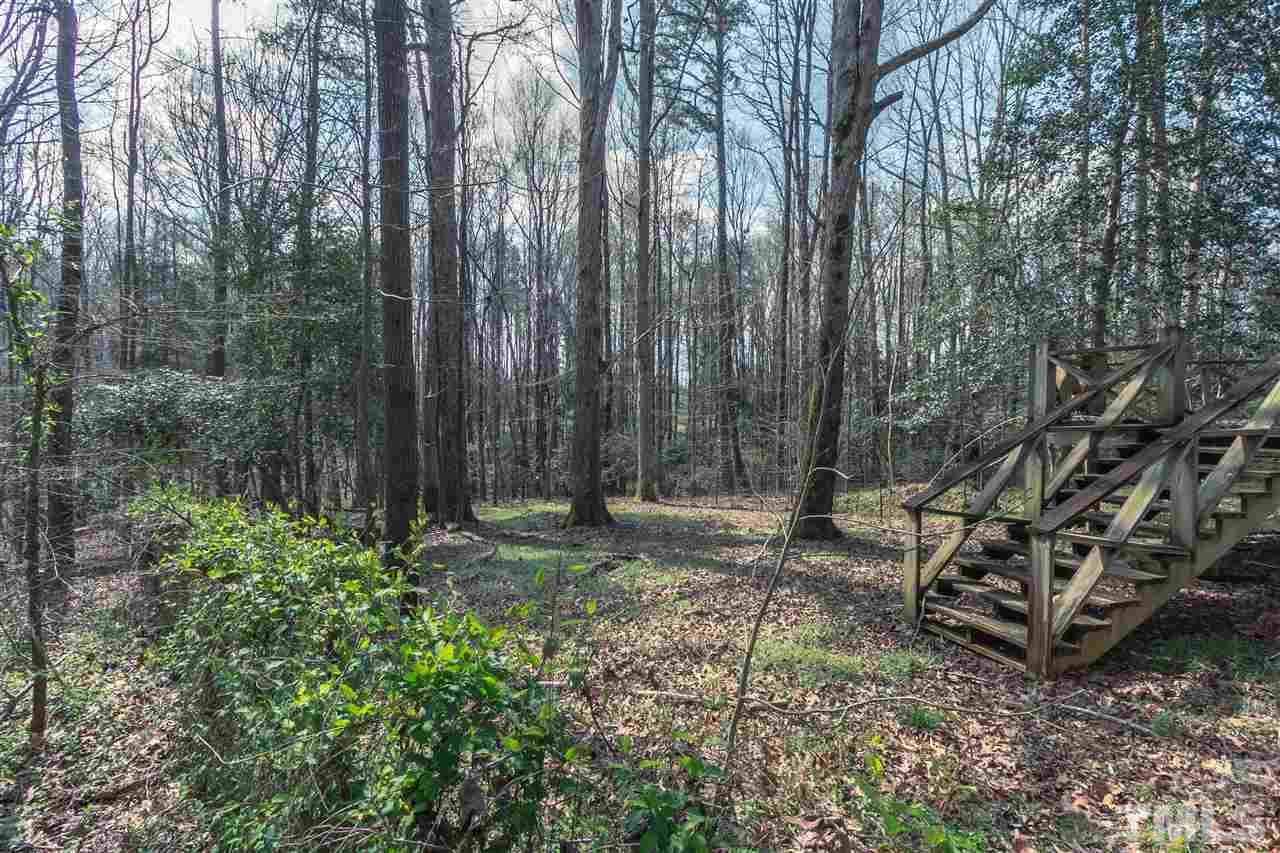 2014 Messer Road Raleigh, NC 27603 - Photo 9 of 27 a backyard of a house with lots of green space