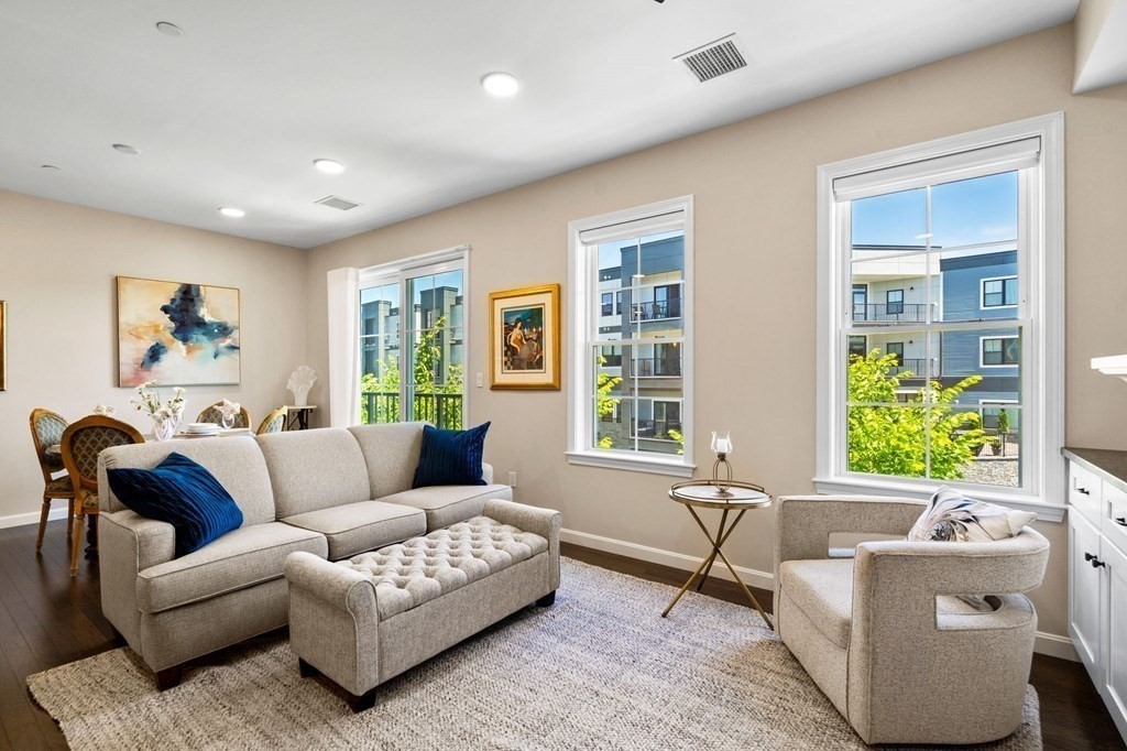 1 Revolution Way, Unit 201 Canton, MA 02021 - Photo 12 of 38 a living room with furniture and windows