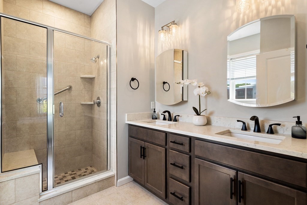 1 Revolution Way, Unit 201 Canton, MA 02021 - Photo 16 of 38 a bathroom with a double vanity sink mirror and shower