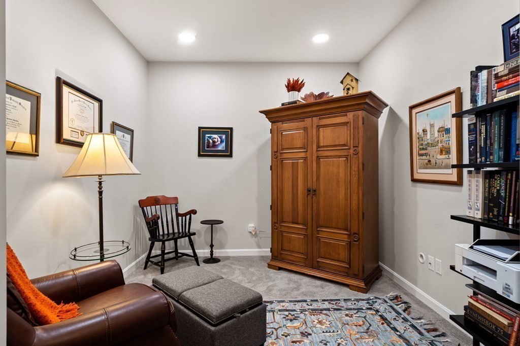 1 Revolution Way, Unit 201 Canton, MA 02021 - Photo 21 of 38 a living room with furniture a lamp and a window