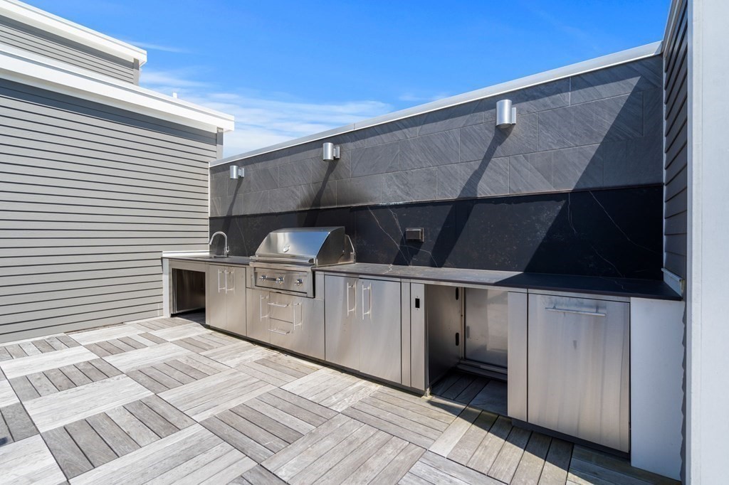 1 Revolution Way, Unit 201 Canton, MA 02021 - Photo 24 of 38 a view of a kitchen with a sink and cabinets