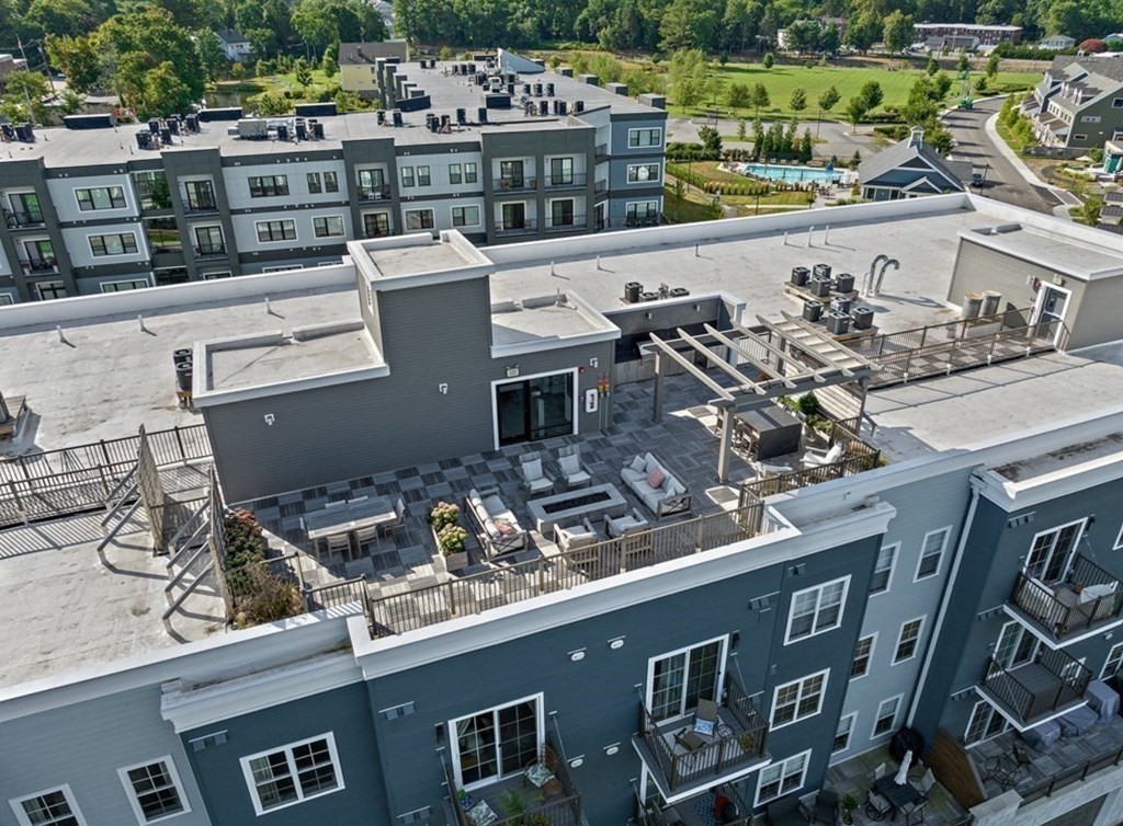1 Revolution Way, Unit 201 Canton, MA 02021 - Photo 25 of 38 a view of a balcony with two chairs and a table