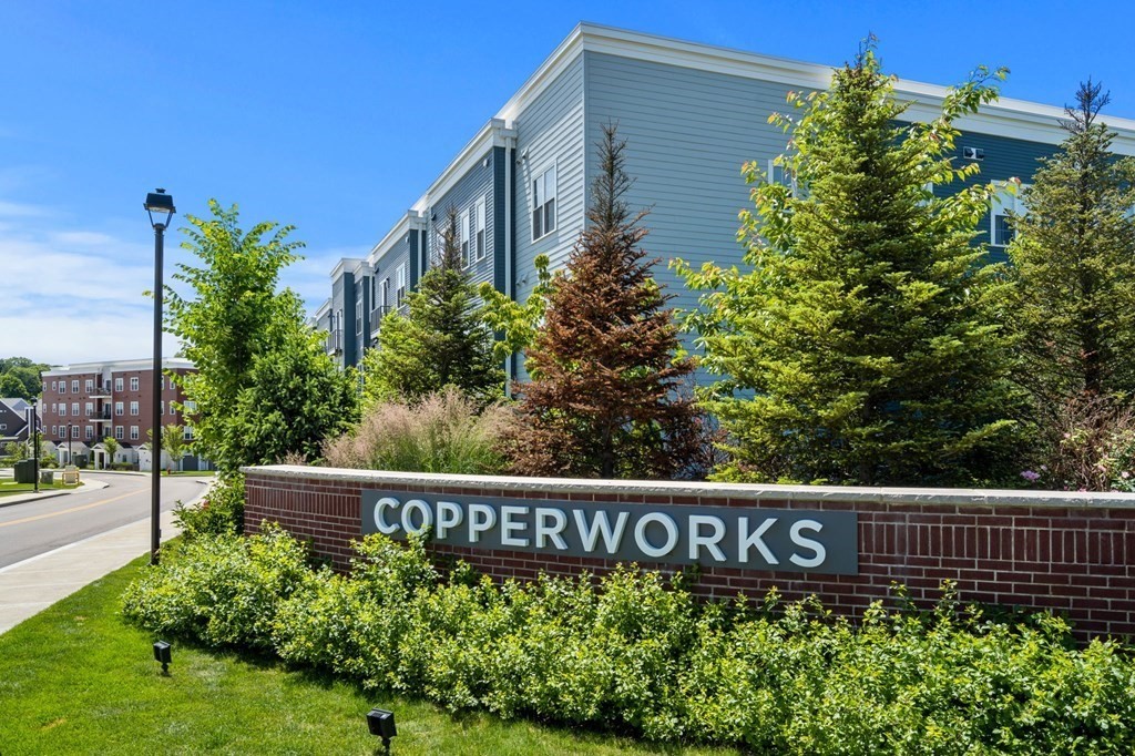1 Revolution Way, Unit 201 Canton, MA 02021 - Photo 3 of 38 a view of sign board with flower plants