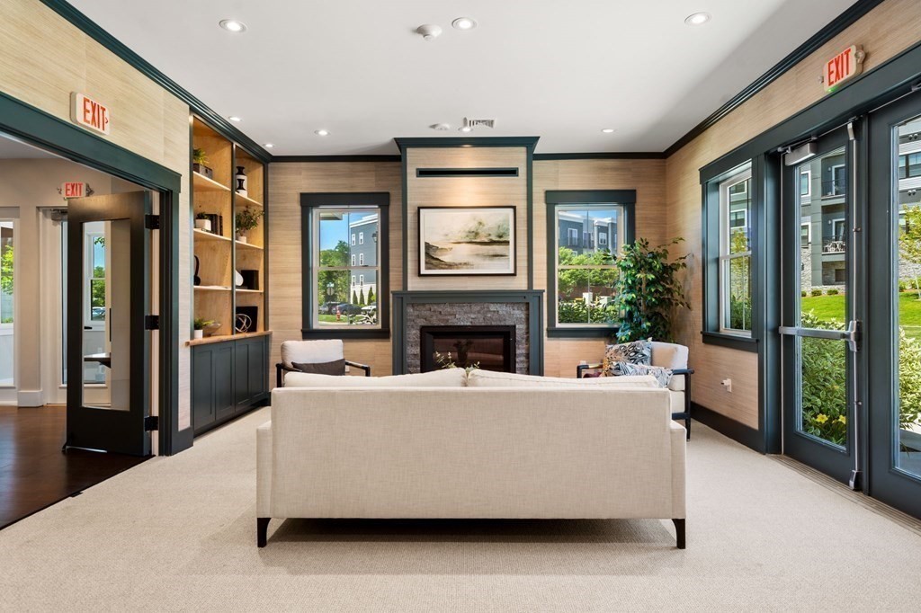 1 Revolution Way, Unit 201 Canton, MA 02021 - Photo 34 of 38 a living room with fireplace furniture and a large window