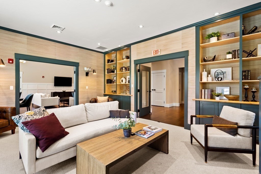 1 Revolution Way, Unit 201 Canton, MA 02021 - Photo 35 of 38 a living room with furniture and a flat screen tv