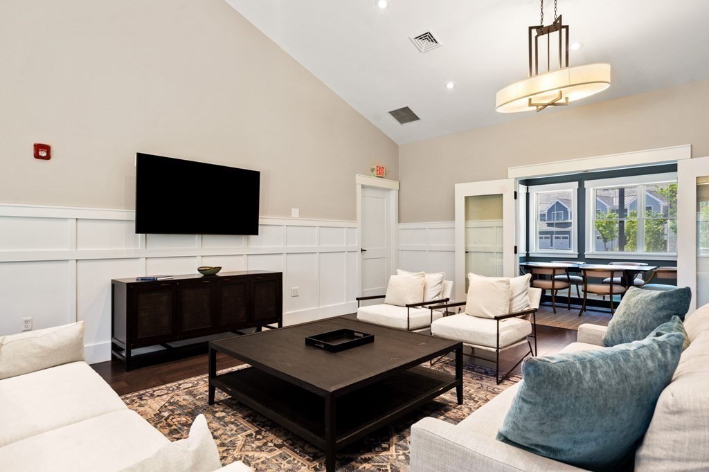 1 Revolution Way, Unit 201 Canton, MA 02021 - Photo 36 of 38 a living room with furniture and a flat screen tv