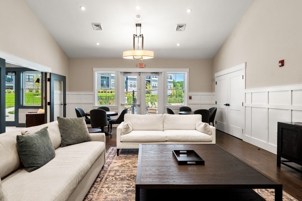1 Revolution Way, Unit 201 Canton, MA 02021 - Photo 37 of 38 a living room with furniture ceiling fan and a window