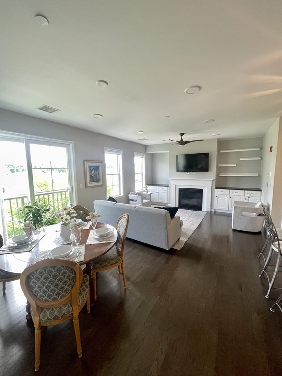 1 Revolution Way, Unit 201 Canton, MA 02021 - Photo 9 of 38 a living room with furniture and a fireplace