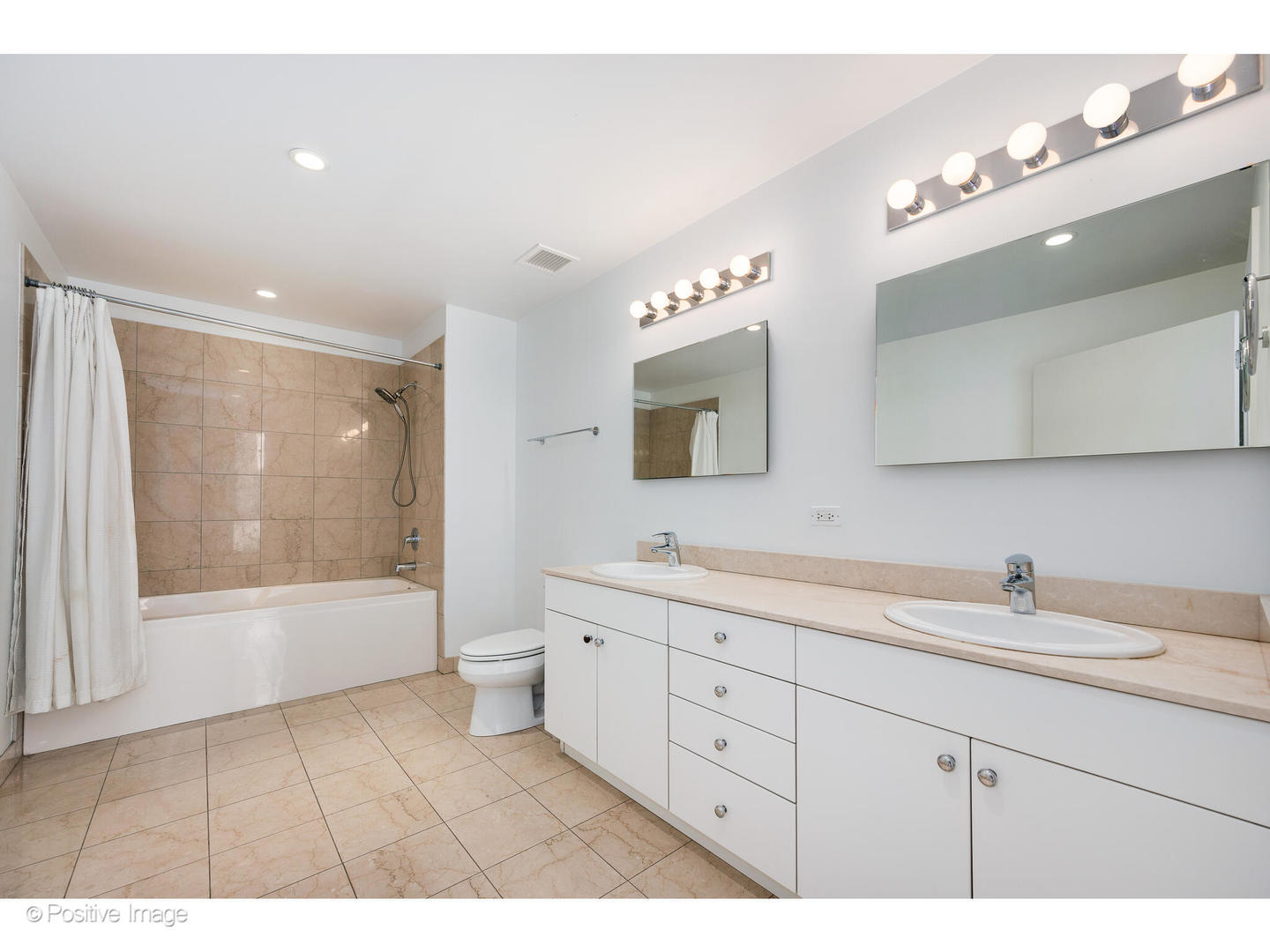 8 East Randolph Street, Unit 2808 Chicago, IL 60601 - Photo 12 of 22 a bathroom with a double vanity sink mirror and bathtub